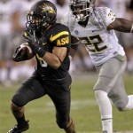 Arizona State running back D.J. Foster gains yards as Oregon linebacker Derrick Malone (22) defends during the second half of an NCAA college football game, Thursday, Oct. 18, 2012, in Tempe, Ariz. (AP Photo/Matt York)