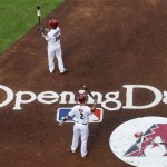 Arizona Diamondbacks' Aaron Hill (2) and Ryan Roberts (14) stand on deck in the second inning of an opening day baseball game against the San Francisco Giants, Friday, April 6, 2012, in Phoenix. (AP Photo/Matt York)