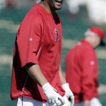Los Angeles Angels' Albert Pujols smiles after taking batting practice before an exhibition spring training baseball game against the San Francisco Giants, Wednesday, Feb. 27, 2013, in Tempe, Ariz. (AP Photo/Morry Gash)