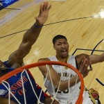 Team Webber's Anthony Davis of the New Orleans Pelicans heads to the basket as Team Hill's Andre Drummond of the Detroit Pistons defends look son during the Rising Star NBA All Star Challenge Basketball game,, Friday, Feb. 14, 2014, in New Orleans. (AP Photo/Bob Donnan, Pool)