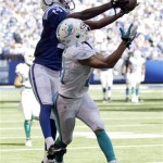 Indianapolis Colts' T.Y. Hilton, left, makes a 47-yard reception over Miami Dolphins' Brent Grimes (21) during the first half an NFL football game Sunday, Sept. 15, 2013, in Indianapolis. (AP Photo/AJ Mast)