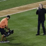 Neil Diamond sings "Sweet Caroline" during the MLB All-Star baseball game, on Tuesday, July 16, 2013, in New York. (AP Photo/Julio Cortez)