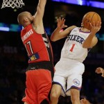 Team Webber's Mason Plumlee of the Brooklyn Nets shoots as Team Hill's Jonas Valanciunas of the Toronto Raptors defends during the Rising Star NBA All Star Challenge Basketball game, Friday, Feb. 14, 2014, in New Orleans. (AP Photo/Gerald Herbert)