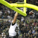 New Orleans Saints' Jimmy Graham spikes the ball through the goal posts after he scored a touchdown in the first half of an NFL football game against the Seattle Seahawks, Monday, Dec. 2, 2013, in Seattle. (AP Photo/Elaine Thompson)