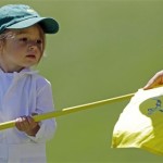 Australia's Aaron Baddeley' daughter Jewel holds the flag from the first green during the Par 3 competition before the Masters golf tournament Wednesday, April 6, 2011, in Augusta, Ga. (AP Photo/Chris O'Meara)