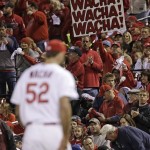 Fans cheer as St. Louis Cardinals starting pitcher Michael Wacha walks back to the dugout during the fourth inning of Game 6 of the National League baseball championship series against the Los Angeles Dodgers Friday, Oct. 18, 2013, in St. Louis. (AP Photo/David J. Phillip)