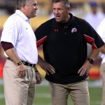Arizona State head coach Todd Graham, left, and Utah head coach Kyle Whittingham, right, talk prior to their teams playing in an NCAA college football game, Saturday, Sept. 22, 2012, in Tempe, Ariz. (AP Photo/Paul Connors)