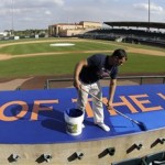 Geo Rodriguez paints the top of a dugout at Osceola County Stadium, the Houston Astros spring training baseball facility, Monday, Feb. 11, 2013 in Viera, Fla. Astros pitchers and catchers first spring training workout is Tuesday. (AP Photo/David J. Phillip)