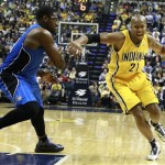  Indiana Pacers forward David West (21) moves with the basketball while defended by Orlando Magic center Jason Maxiell in the second half of an NBA basketball game in Indianapolis, Tuesday, Oct. 29, 2013. Indiana won 97-87. (AP Photo/R Brent Smith)