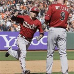 Arizona Diamondbacks' John McDonald, left, is congratulated by third base coach Matt Williams (9) after hitting a solo home run off of San Francisco Giants pitcher Barry Zito during the eighth inning of a baseball game in San Francisco, Monday, May 28, 2012. (AP Photo/Jeff Chiu)
