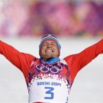 Russia's Alexander Legkov celebrates winning the gold during the flower ceremony of the men's 50K cross-country race at the 2014 Winter Olympics, Sunday, Feb. 23, 2014, in Krasnaya Polyana, Russia. (AP Photo/Matthias Schrader)