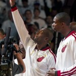  Miami Heat's Dwyane Wade, left, holds up his championship ring as Chris Bosh looks on during a ceremony before their season-opening NBA basketball game against the Chicago Bulls, Tuesday, Oct. 29, 2013, in Miami. (AP Photo/The Miami Herald, Al Diaz) MAGS OUT