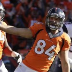 Denver Broncos tight end Jacob Tamme celebrates his one-yard touchdown catch during the first half of the AFC Championship NFL playoff football game against the New England Patriots in Denver, Sunday, Jan. 19, 2014. (AP Photo/Charlie Riedel)