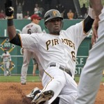Pittsburgh Pirates' Starling Marte slides into third with a triple in the seventh inning of the baseball game against the Arizona Diamondbacks, Thursday, Aug. 9, 2012, in Pittsburgh. The Diamondbacks won 6-3. (AP Photo/Keith Srakocic)