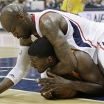 Indiana Pacers center Roy Hibbert (55) and Atlanta Hawks center Johan Petro (10) vie for a loose ball during the first half of an NBA first-round playoff basketball game in Atlanta, Friday, May 3, 2013. (AP Photo/John Bazemore)