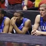 Duke's players from left, Tyler Thornton, Rasheed Sulaimon and Mason Plumlee watch the final seconds of the Midwest Regional final against Louisville in the NCAA college basketball tournament, Sunday, March 31, 2013, in Indianapolis. Louisville won 85-63 to advance to the Final Four. (AP Photo/Michael Conroy)