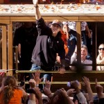 San Francisco Giants pitcher Tim Lincecum celebrates as fans cheer as he rides in a motorized cable car during a baseball World Series parade in downtown San Francisco, Wednesday, Nov. 3, 2010. The Giants defeated the Texas Rangers in five games for their first championship since the team moved west from New York 52 years ago. (AP Photo/Darryl Bush)
