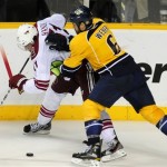 Nashville Predators defenseman Shea Weber (6) checks Phoenix Coyotes' Martin Hanzal (11), of the Czech Republic, in the second period of Game 4 in an NHL hockey Stanley Cup Western Conference semifinal playoff series, Friday, May 4, 2012, in Nashville, Tenn. (AP Photo/Mike Strasinger)