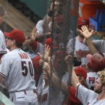 Arizona Diamondbacks' Trevor Cahill (35) is greeted in the dugout after he scored on a home run by Martin Prado, in helmet at right in the dugout, during the third inning of a baseball game against the Pittsburgh Pirates on Saturday, Aug. 17, 2013, in Pittsburgh. (AP Photo/Keith Srakocic)