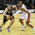 San Antonio Spurs shooting guard Manu Ginobili (20) of Argentina, and Miami Heat shooting guard Ray Allen (34) work during the first half of Game 2 of the NBA Finals basketball game, Sunday, June 9, 2013 in Miami. (AP Photo/Wilfredo Lee