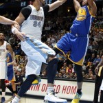 Golden State Warriors guard Jarret Jack, right, shoots as Denver Nuggets forward JaVale McGee defends during the first quarter of Game 5 of their first-round NBA basketball playoff series, Tuesday, April 30, 2013, in Denver. (AP Photo/David Zalubowski)