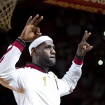  Miami Heat's LeBron James gestures during an NBA championship ring ceremony, before the Heat's basketball game against the Chicago Bulls in Miami, Tuesday, Oct. 29, 2013. (AP Photo/J Pat Carter)