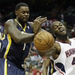 Atlanta Hawks power forward Ivan Johnson (44) loses the ball under the defense of Indiana Pacers shooting guard Lance Stephenson (1) and Indiana Pacers power forward David West (21) during the second half in Game 4 of their first-round NBA basketball game, Monday, April 29, 2013 in Atlanta. (AP Photo/John Bazemore)