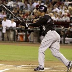 Colorado Rockies' Melvin Mora connects on a home run, scoring three runs, against the Arizona Diamondbacks during the first inning of a baseball game Wednesday, Sept. 22, 2010, in Phoenix. (AP Photo/Ross D. Franklin)
