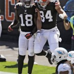 Cleveland Browns wide receiver Greg Little (18) celebrates with tight end Jordan Cameron (84) after Cameron's 7-yard touchdown catch against the Miami Dolphins in the second quarter of an NFL football game Sunday, Sept. 8, 2013, in Cleveland. (AP Photo/Tony Dejak)