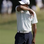 Tiger Woods reacts to a putt on the 12th green during the third round of the U.S. Open golf tournament at Merion Golf Club, Saturday, June 15, 2013, in Ardmore, Pa. (AP Photo/Darron Cummings)
