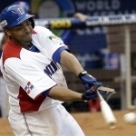 Dominican Republic's Nelson Cruz breaks his bat on a base hit against Italy in the seventh inning of the World Baseball Classic game in Miami, Tuesday, March 12, 2013. The Dominican Republic won 5-4. Robinson Cano scored on the single. (AP Photo/Alan Diaz)