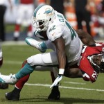 Atlanta Falcons strong safety William Moore (25) tackles Miami Dolphins tight end Charles Clay (42) during the first half of an NFL football game, Sunday, Sept. 22, 2013, in Miami Gardens, Fla. (AP Photo/Wilfredo Lee)