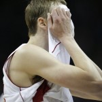 Wisconsin forward Sam Dekker (15) wipes his face following a second-round game against Mississippi in the NCAA college basketball tournament at the Sprint Center in Kansas City, Mo., Friday, March 22, 2013. Mississippi defeated Wisconsin 57-46. (AP Photo/Orlin Wagner)