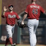 Arizona Diamondbacks right fielder Cody Ross, left, celebrates with pitcher Matt Reynolds (45) after the final out of the tenth inning of a baseball game against the San Francisco Giants in San Francisco, Wednesday, April 24, 2013. The Diamondbacks won 3-2. (AP Photo/Jeff Chiu)