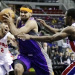 Phoenix Suns guard Jared Dudley (3) drives to the basket between Detroit Pistons forward Tayshaun Prince (22) and guard Brandon Knight (7) in the first half of an NBA basketball game, Wednesday, Nov. 28, 2012, in Auburn Hills, Mich. (AP Photo/Duane Burleson)
