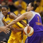 Los Angeles Sparks' Alana Beard, left, passes the ball around Phoenix Mercury's Diana Taurasi, right, during the first half in Game 1 of their WNBA basketball Western Conference semifinal series on Thursday, Sept. 19, 2013, in Los Angeles. (AP Photo/Danny Moloshok)