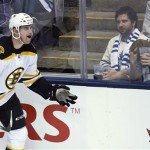 Boston Bruins forward Daniel Paille celebrates his goal as Toronto Maple Leafs fans react during the second period of Game 3 of their first-round NHL hockey Stanley Cup playoff series, Monday, May 6, 2013, in Toronto. (AP Photo/The Canadian Press, Nathan Denette)