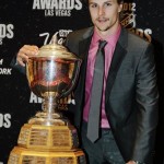 Ottawa Senators' Erik Karlsson poses with the Norris Trophy after winning the award for the best defenseman during the NHL Awards, Wednesday, June 20, 2012, in Las Vegas. (AP Photo/Julie Jacobson)
