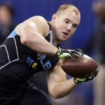 Wisconsin linebacker Chris Borland makes a catch as he runs a drill at the NFL football scouting combine in Indianapolis, Monday, Feb. 24, 2014. (AP Photo/Michael Conroy)