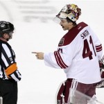  Phoenix Coyotes goalie Mike Smith (41) argues with referee Greg Kimmerly (18) in the third period of an NHL hockey game against the Nashville Predators Monday, Nov. 25, 2013, in Nashville, Tenn. The Predators won 4-2. (AP Photo/Mark Humphrey)
