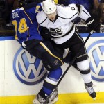 St. Louis Blues' TJ Oshie (74) collides with Los Angeles Kings' Drew Doughty (8) in overtime of Game 1 of their first-round NHL hockey Stanley Cup playoff series, Tuesday, April 30, 2013, in St. Louis. The Blues won 2-1. (AP Photo/Bill Boyce)