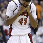 UNLV forward Mike Moser (43) covers his face during the second half of a second-round game in the NCAA college basketball tournament against California in San Jose, Calif., Thursday, March 21, 2013. California won 64-61. (AP Photo/Ben Margot)