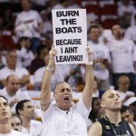 A fan holds a sign before the first half in Game 7 of the NBA basketball championships between the Miami Heat and the San Antonio Spurs, Thursday, June 20, 2013, in Miami. (AP Photo/Lynne Sladky)