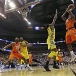 Syracuse forward C.J. Fair (5) shoots over Marquette forward Jamil Wilson (0) during the second half of the East Regional final in the NCAA men's college basketball tournament, Saturday, March 30, 2013, in Washington. (AP Photo/Pablo Martinez Monsivais)