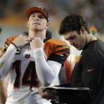 Cincinnati Bengals quarterback Andy Dalton (14) looks up before looking at play copies on the sideline during the first half of an NFL football game against the Miami Dolphins, Thursday, Oct. 31, 2013, in Miami Gardens, Fla. (AP Photo/Lynne Sladky)