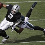  Oakland Raiders quarterback Terrelle Pryor (2) is tackled by Philadelphia Eagles strong safety Nate Allen (29) during the first quarter of an NFL football game in Oakland, Calif., Sunday, Nov. 3, 2013. (AP Photo/Marcio Jose Sanchez)