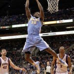 Denver Nuggets forward Kenneth Faried (35) goes up for a dunk against the Phoenix Suns during the first half of a preseason NBA basketball game, Friday, Oct. 26, 2012, in Phoenix. (AP Photo/Matt York)