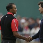 Tiger Woods of the United States, left, and Adam Scott of Australia shake hands after their final round of the British Open Golf Championship at Muirfield, Scotland, Sunday, July 21, 2013. (AP Photo/Jon Super)