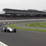 Ed Carpenter leads the field through the first turn at the start of the Indianapolis 500 auto race at Indianapolis Motor Speedway in Indianapolis, Sunday, May 26, 2013. (AP Photo/Tom Strattman)