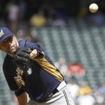 Milwaukee Brewers' Shaun Marcum gets the ball back from the catcher during the second inning of an exhibition baseball game against the Arizona Diamondbacks, Wednesday, April 4, 2012, in Phoenix. (AP Photo/Ross D. Franklin)